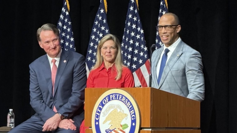 Secretary Turner behind a podium